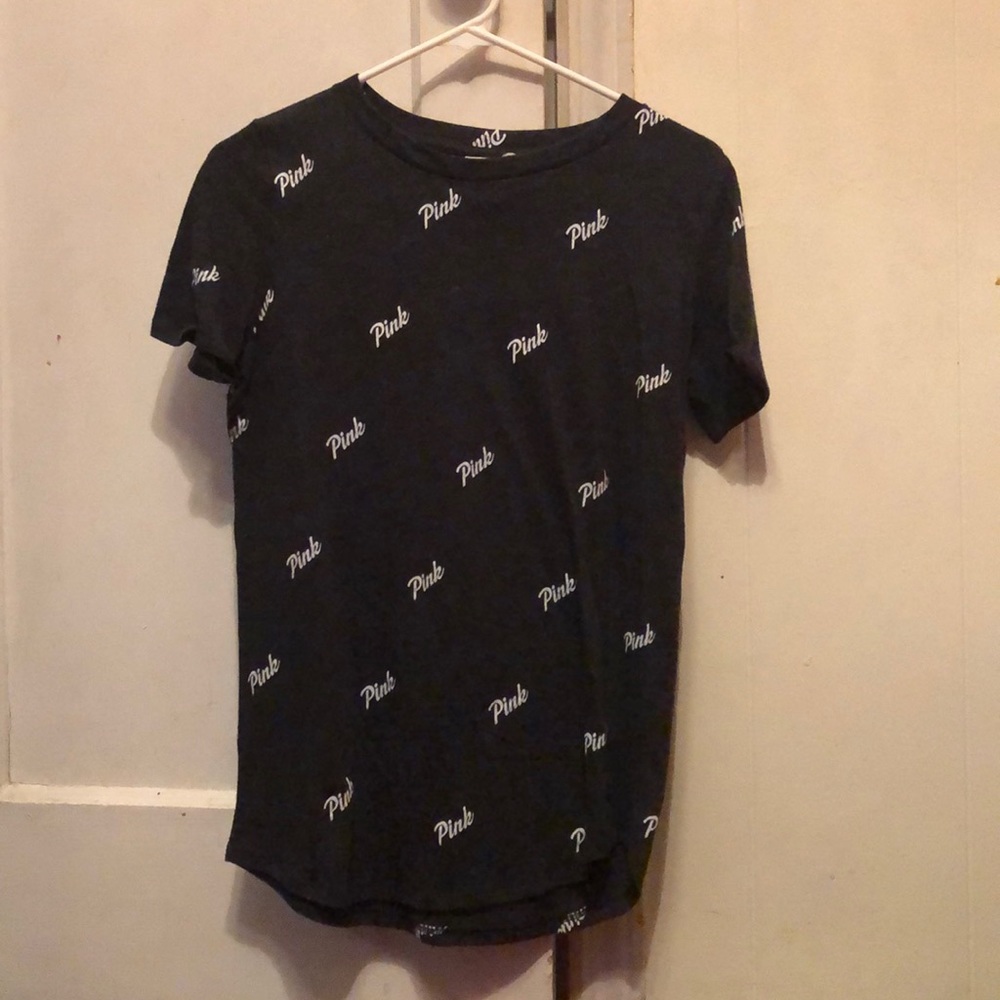Short sleeve pink brand shirt.